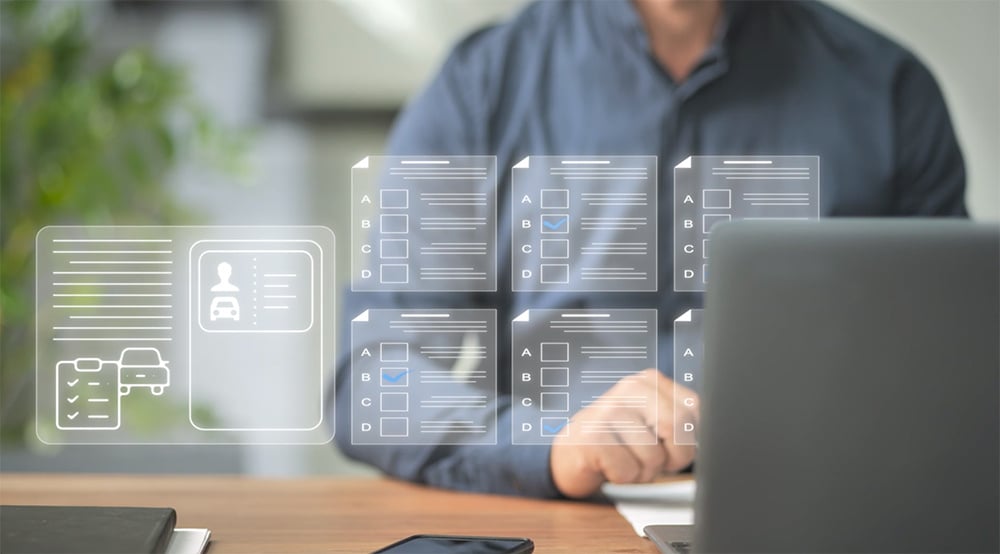 a checklist graphic over a man working at the computer